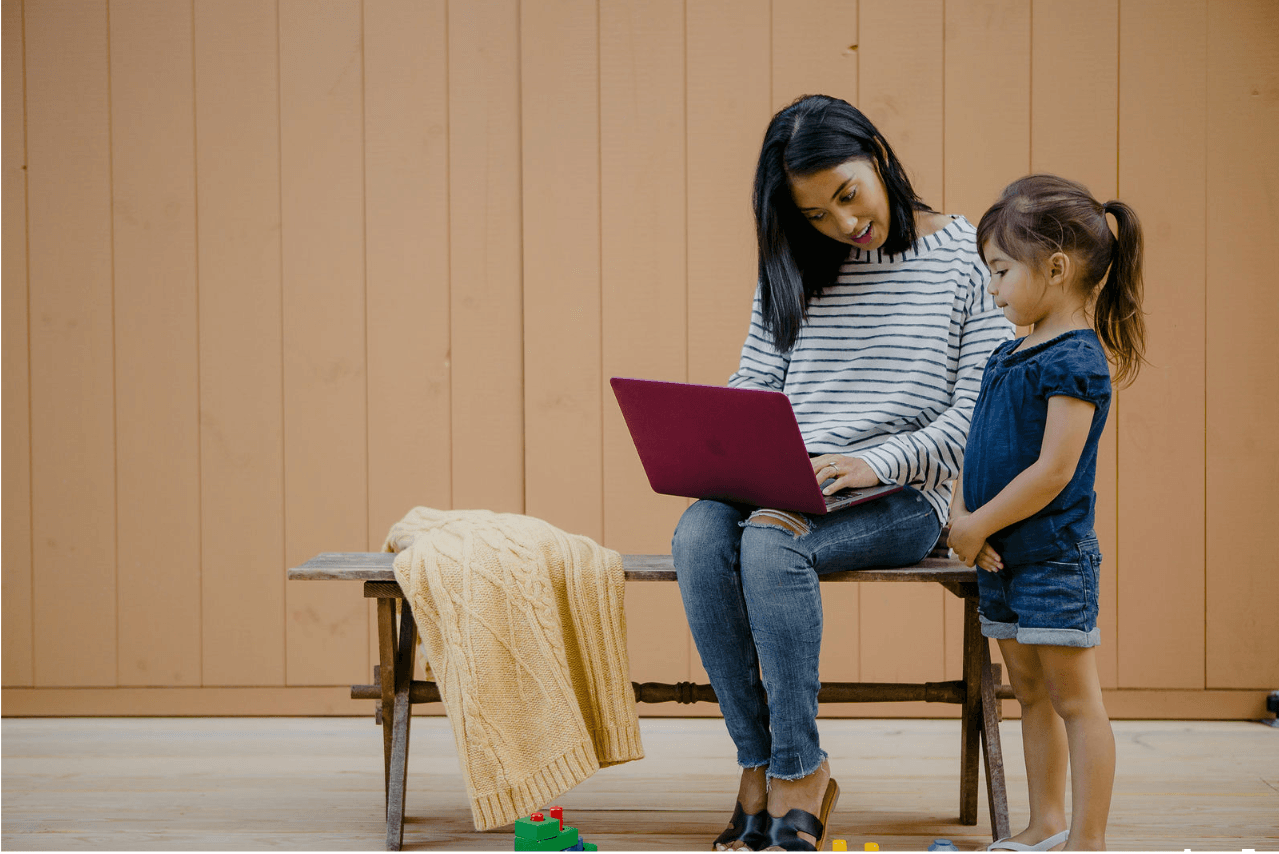 Mother and daughter looking at computer