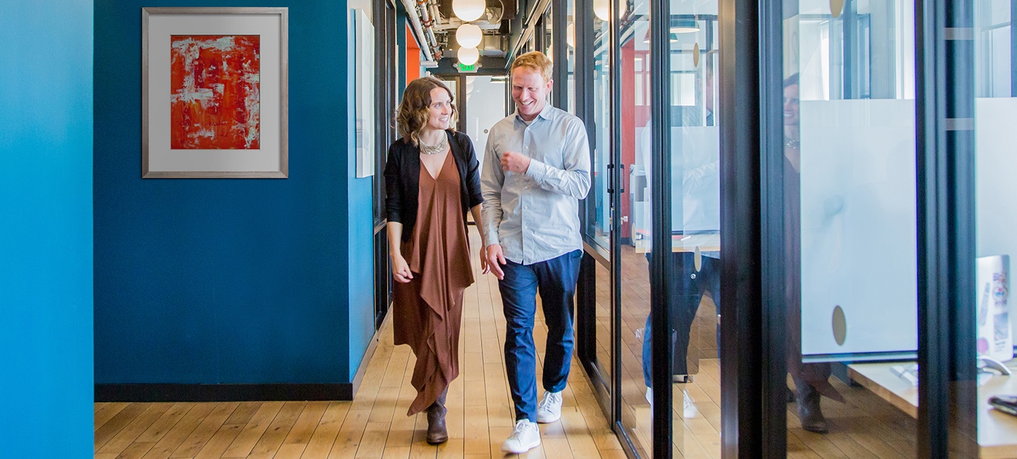 GAF Energy employees walking down hallway