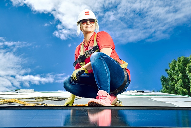 GAF Energy Solar panel roof shingles and worker